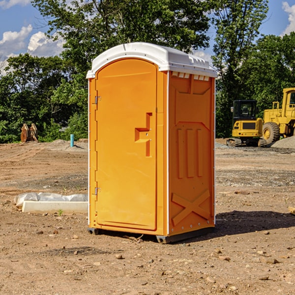 what is the cost difference between standard and deluxe portable toilet rentals in Finley